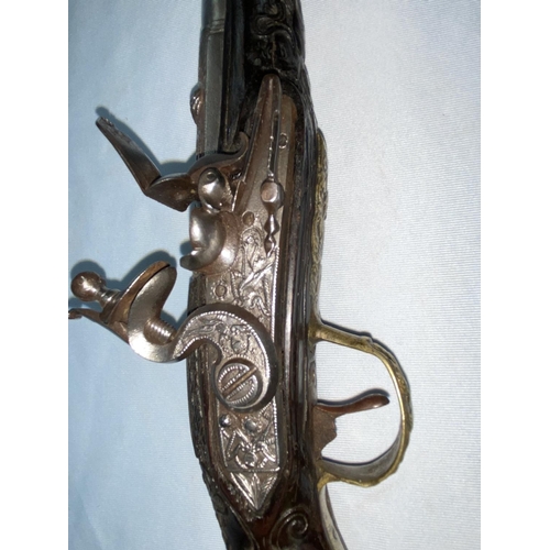 372 - A late 18th century/early 19th century Ottoman blunderbuss pistol with extensive chased relief decor... 