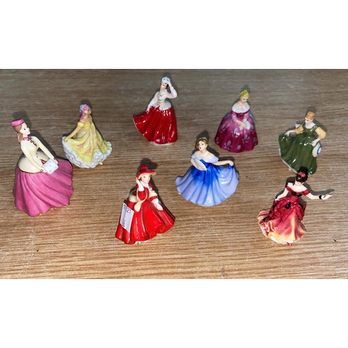 86 - 7 miniature Royal Doulton figures of ladies; a ceramic larger figure of lady seated