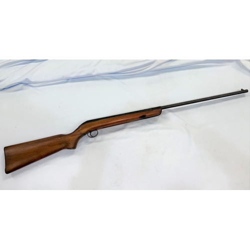 383 - An air rifle with wooden stock stamped CA42717