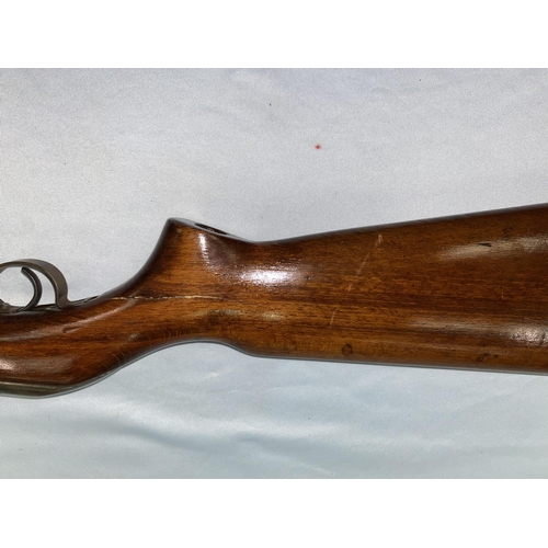 384 - An air rifle with wooden stock stamped BC12263