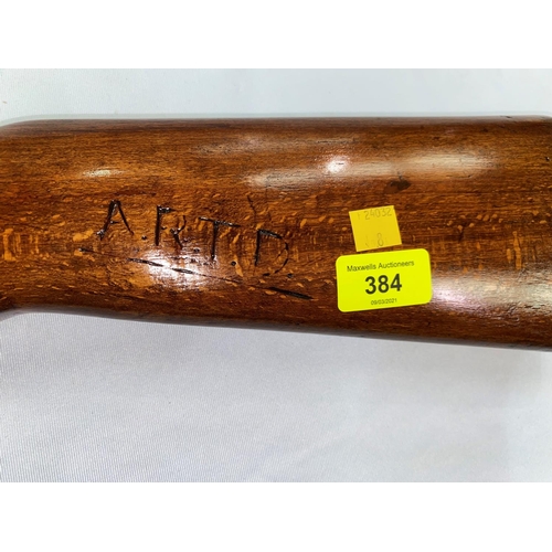 384 - An air rifle with wooden stock stamped BC12263