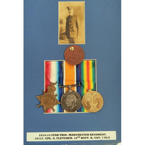 354 - 10117 Corporal A. Fletcher, 18th Battalion, Manchester Regiment 1914-15 Star trio, mounted with phot... 