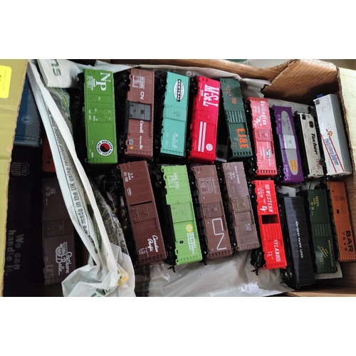 566 - A large selection of American railroad box - cars, various marques