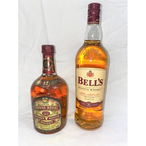 529 - A bottle of 12 year old Chivas Regal blended whisky; a litre bottle of Bells 8 year old blended whis... 