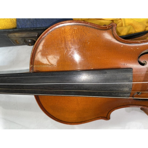 545 - A mid 20th century violin with 2 piece back, length of body 35.5cm with bow and hard case