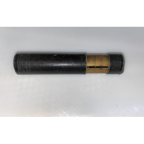 796 - A cylindrical brass & leather sprung coin holder (holds 50)