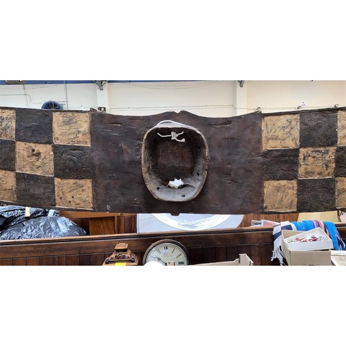 184 - An East African tribal carved wood hawk mask, Bwa shallow carved geometric decoration painted in ear... 