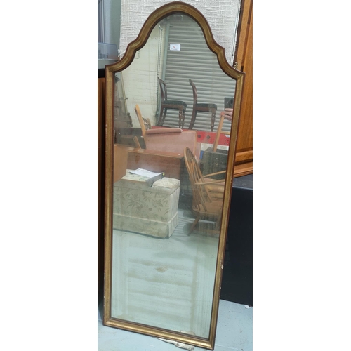 24 - A period style wall mirror in arch top parcel gilt frame; a Persian design rug with blue ground