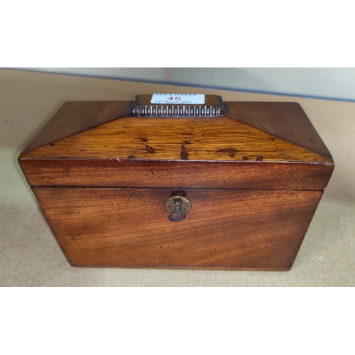 45 - An early 19th century mahogany tea caddy, sarcophagus shaped with 2 divisions