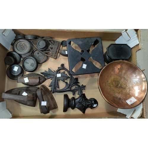 35 - A set of old kitchen scales; various weights; flatirons; etc.