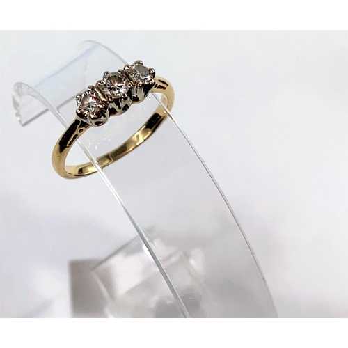 357 - A yellow metal dress ring set 3 diamonds, centre stone .2 approx, side stones 1.5 approx, unmarked t... 