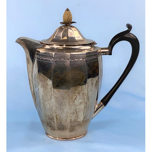 296 - A hallmarked silver coffee pot of ribbed oval form with pineapple finial and chased decoration
Sheff... 