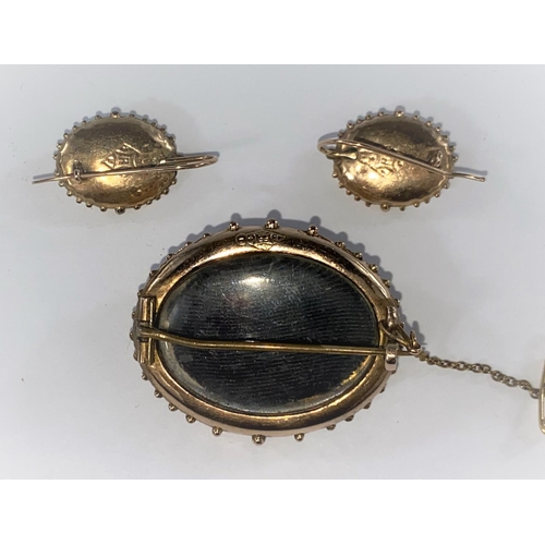 365 - A Victorian matching earring and brooch set, oval brooch with patterned front, bobbled edges, safety... 