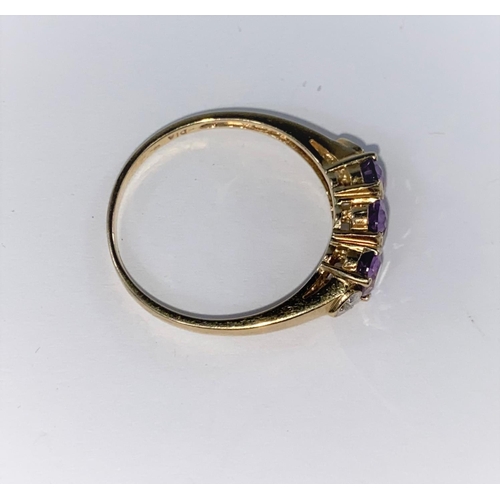 367 - A 9ct hallmarked 3 stone amethyst ring with a small diamond at each end, size T; a sapphire & cubic ... 