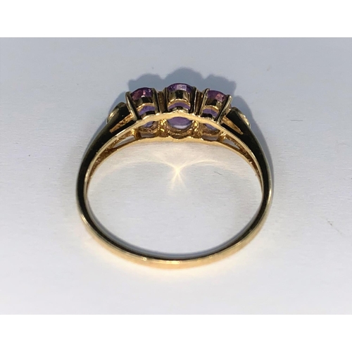 367 - A 9ct hallmarked 3 stone amethyst ring with a small diamond at each end, size T; a sapphire & cubic ... 