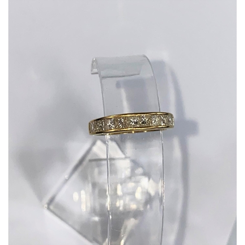 369 - A yellow gold half eternity ring with 9 baguette cut diamonds (approximately 1ct) stamped 18K size M... 
