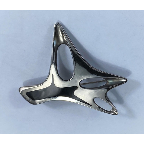 397 - Georg Jensen, a silver brooch designed by Henning Koppel of modernist pierced abstract form and blac... 