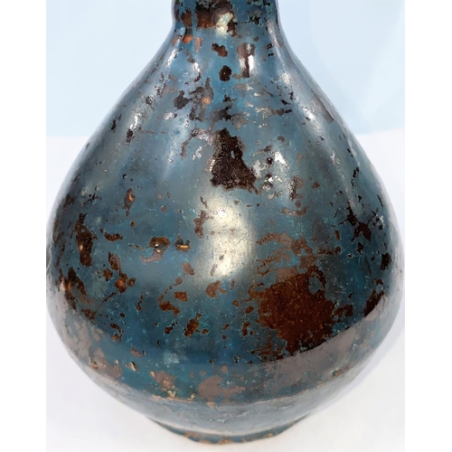 253 - A Chinese pottery vase of ovoid form with thick brown glaze overpainted in dark blue, character mark... 