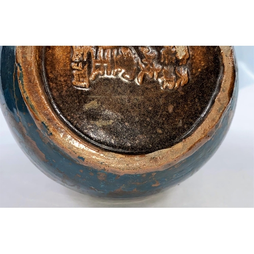 253 - A Chinese pottery vase of ovoid form with thick brown glaze overpainted in dark blue, character mark... 