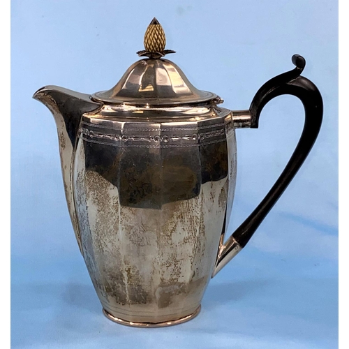 296 - A hallmarked silver coffee pot of ribbed oval form with pineapple finial and chased decoration
Sheff... 