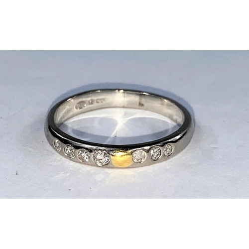358 - A white metal wedding ring set 2 rows of 4 x 3 small diamonds, bearing foreign marks, tests as circa... 