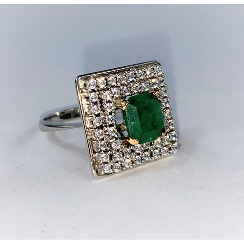 360 - A white metal Art Deco style ring set square emerald surrounded by clear stones, tests as 14 ct, 8.5... 
