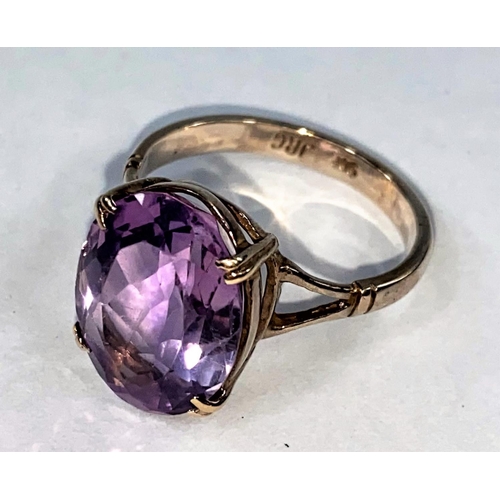 362 - A 9 carat gold dress ring set large amethyst coloured stone, 4.8 gm. size R.5