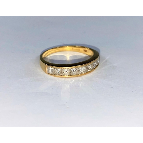 369 - A yellow gold half eternity ring with 9 baguette cut diamonds (approximately 1ct) stamped 18K size M... 