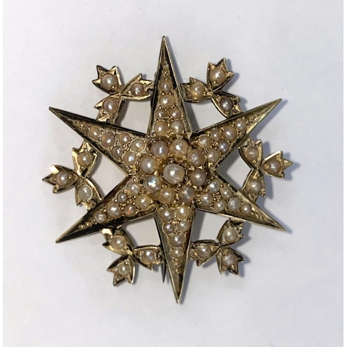 378 - A 15 carat gold six point star brooch set see pearls, 7.4gm gross