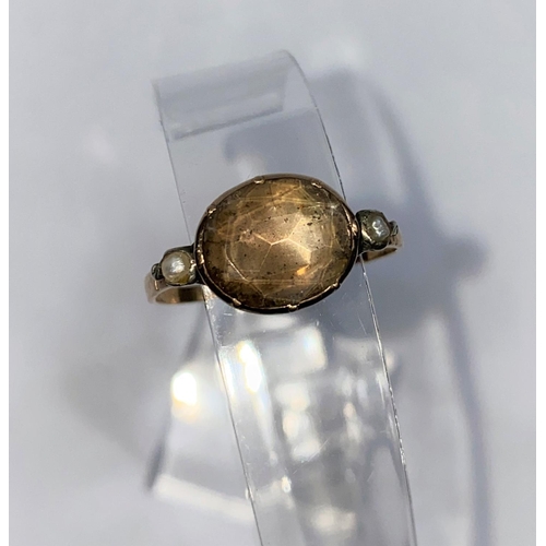 383 - A late Georgian gold dress ring set single oval cut and foiled back stone, with single seed pearl to... 