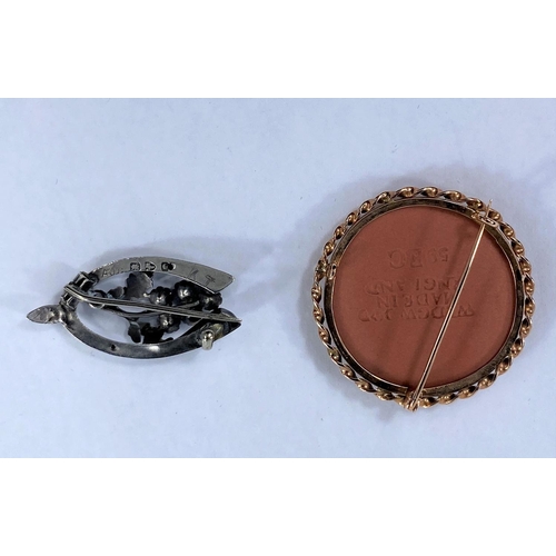 384 - A hallmarked silver wishbone brooch with oakleaf and clear stone set centre and a pink and basalt We... 