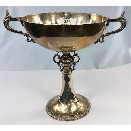 386 - A hallmarked silver trophy bowl, 2 handles and pedestal base with ornate relief decoration, inscribe... 