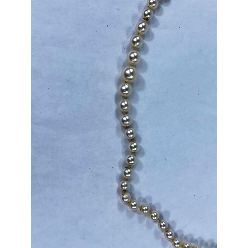 412 - A single string graduating cultured pearl necklace with seed pearls set 9ct hallmarked gold clasp