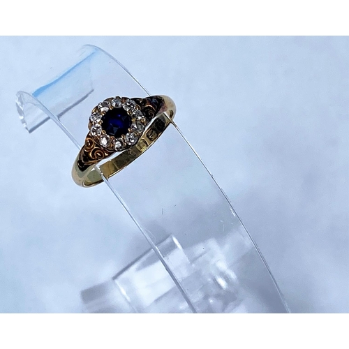 416 - An early 20th century 18ct hallmarked gold sapphire and diamond cluster set central sapphire surroun... 