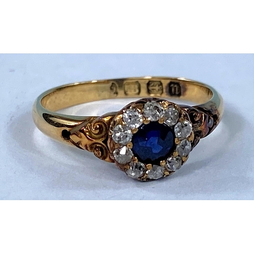 416 - An early 20th century 18ct hallmarked gold sapphire and diamond cluster set central sapphire surroun... 