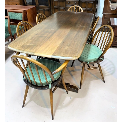 599 - An Ercol period style dining suite in dark oak comprising rectangular refectory table,  6 (4 + 2) ch... 