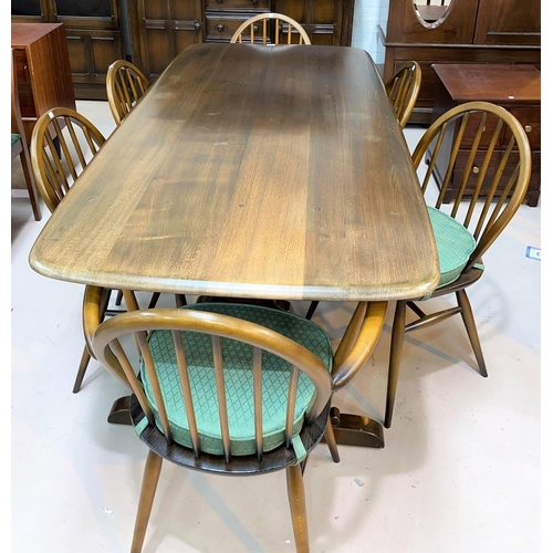 599 - An Ercol period style dining suite in dark oak comprising rectangular refectory table,  6 (4 + 2) ch... 