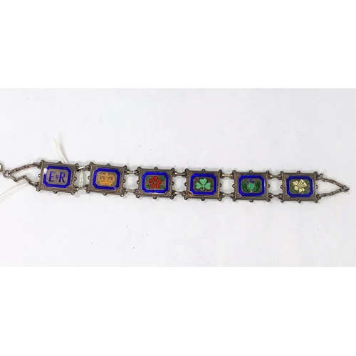 333 - A commemorative QEII bracelet decorated with floral emblems of each UK country in coloured enamels