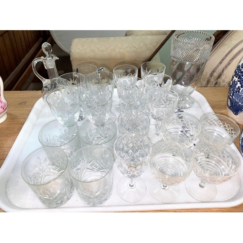 169 - A large selection of cut glass including impressive large cut glass vase, decanters etc