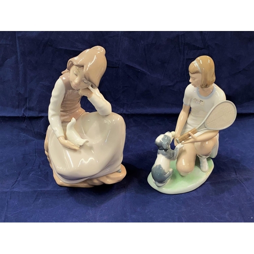 229 - Two Nao groups:  kneeling girl with puppy, height 23.5 cm & seated girl with dove, height 25 cm