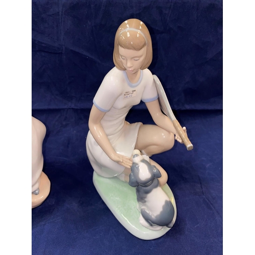 229 - Two Nao groups:  kneeling girl with puppy, height 23.5 cm & seated girl with dove, height 25 cm