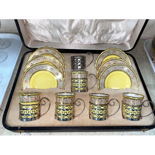 185 - A cased set of 6 Aynsley coffee cups and saucers in pierced hallmarked silver holders, Sheffield 192... 