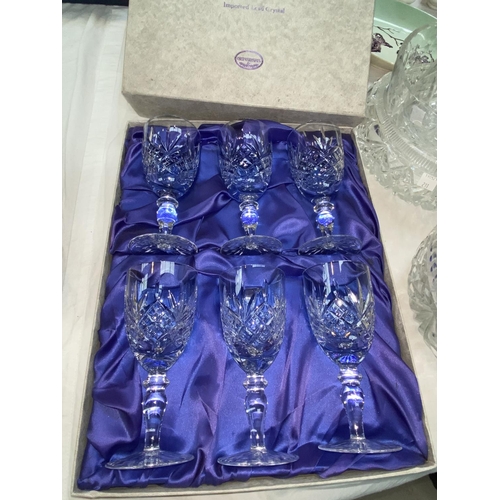 216 - An Edinburgh Crystal set of  wine glasses, boxed; cut and coloured glassware