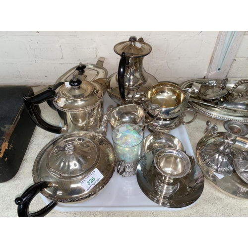 326 - Two 4 piece silver plated tea sets; 4 silver plated dwarf candlesticks; other silver plate