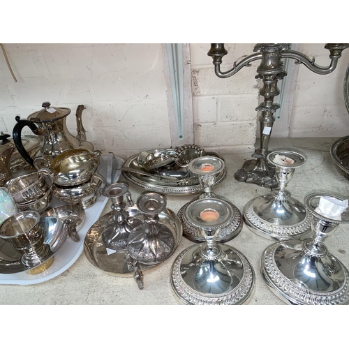 326 - Two 4 piece silver plated tea sets; 4 silver plated dwarf candlesticks; other silver plate