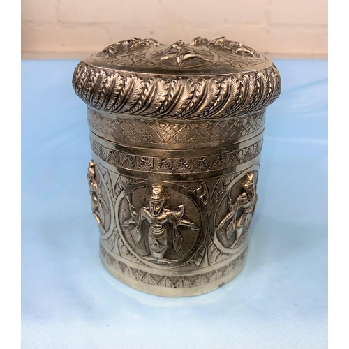 355 - A 19th century Indian silver cylindrical tea caddy with compressed cover, engraved and repousse deco... 