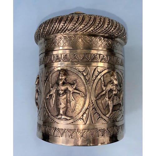 355 - A 19th century Indian silver cylindrical tea caddy with compressed cover, engraved and repousse deco... 