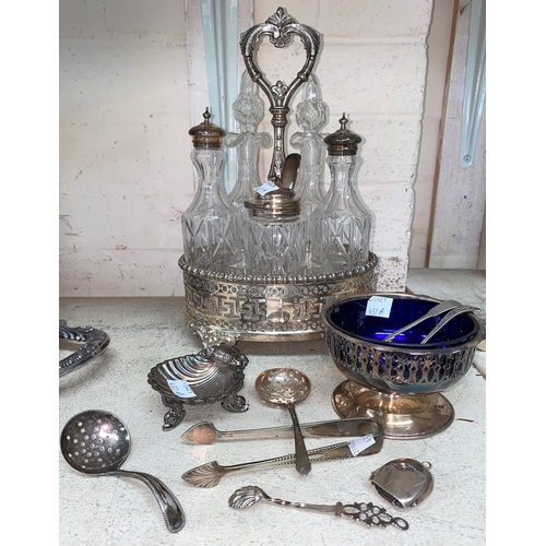 437A - A 5 bottle glass cruet set in pierced EPNS stand; a small hallmarked silver bell and other silver pl... 
