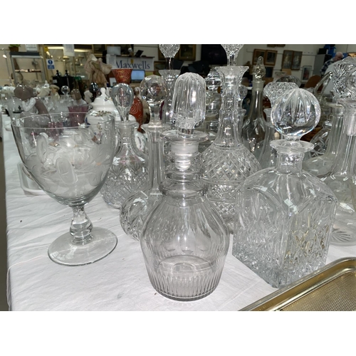 239 - A collection of cut decanters, 17 approx (some stoppers matched; some chips)