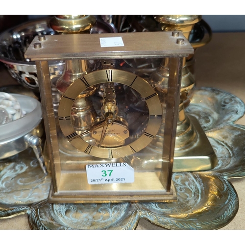 37 - A mid 20th century 'Uwestra' unusual skeleton/mantel clock in gilt metal; decorative brassware; etc.